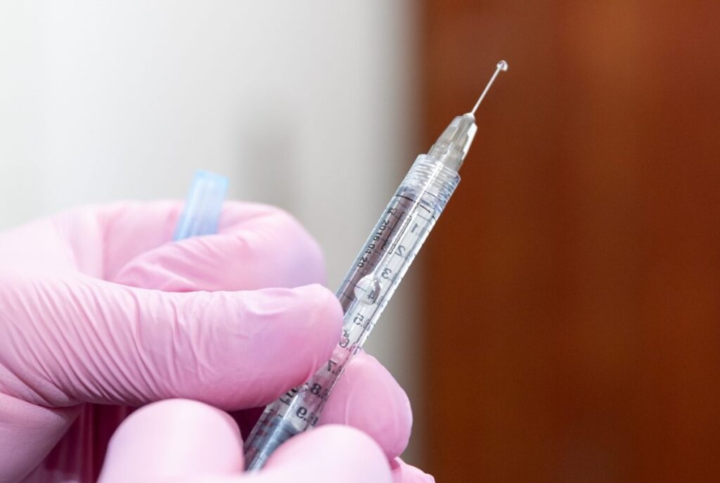 A provider is preparing a syringe for a patient receiving weight loss injections in Colorado Springs.